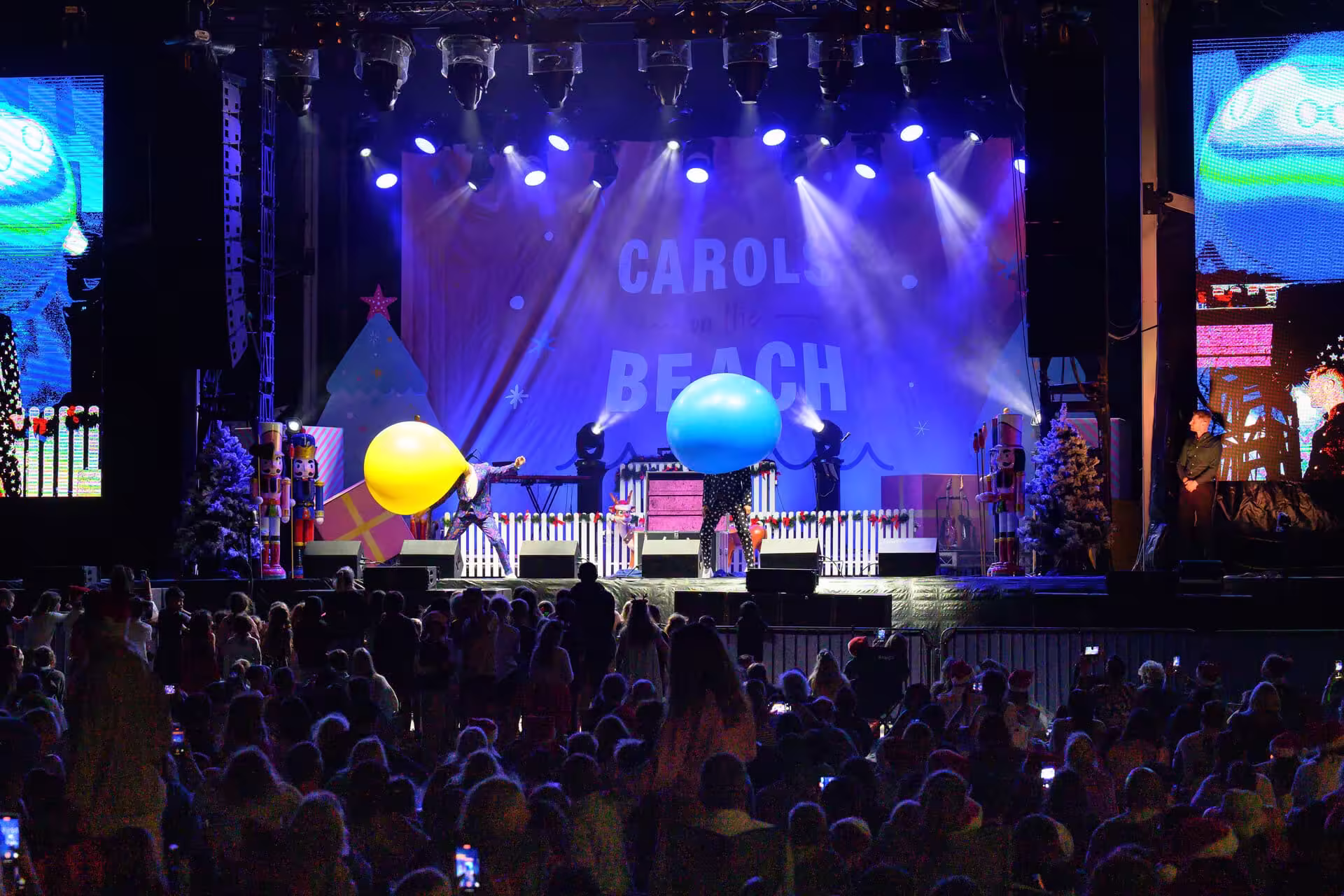Outdoor beach concert event crowd enjoying live entertainment