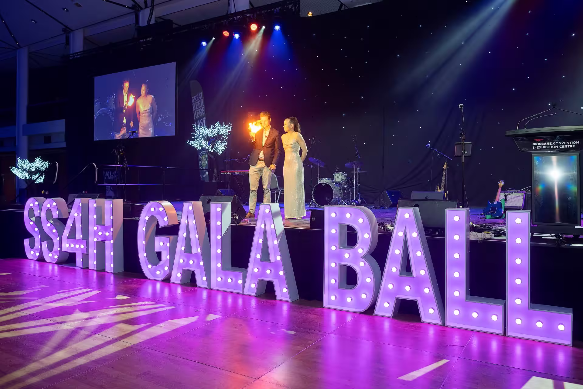Jason Gray performing at a formal gala event