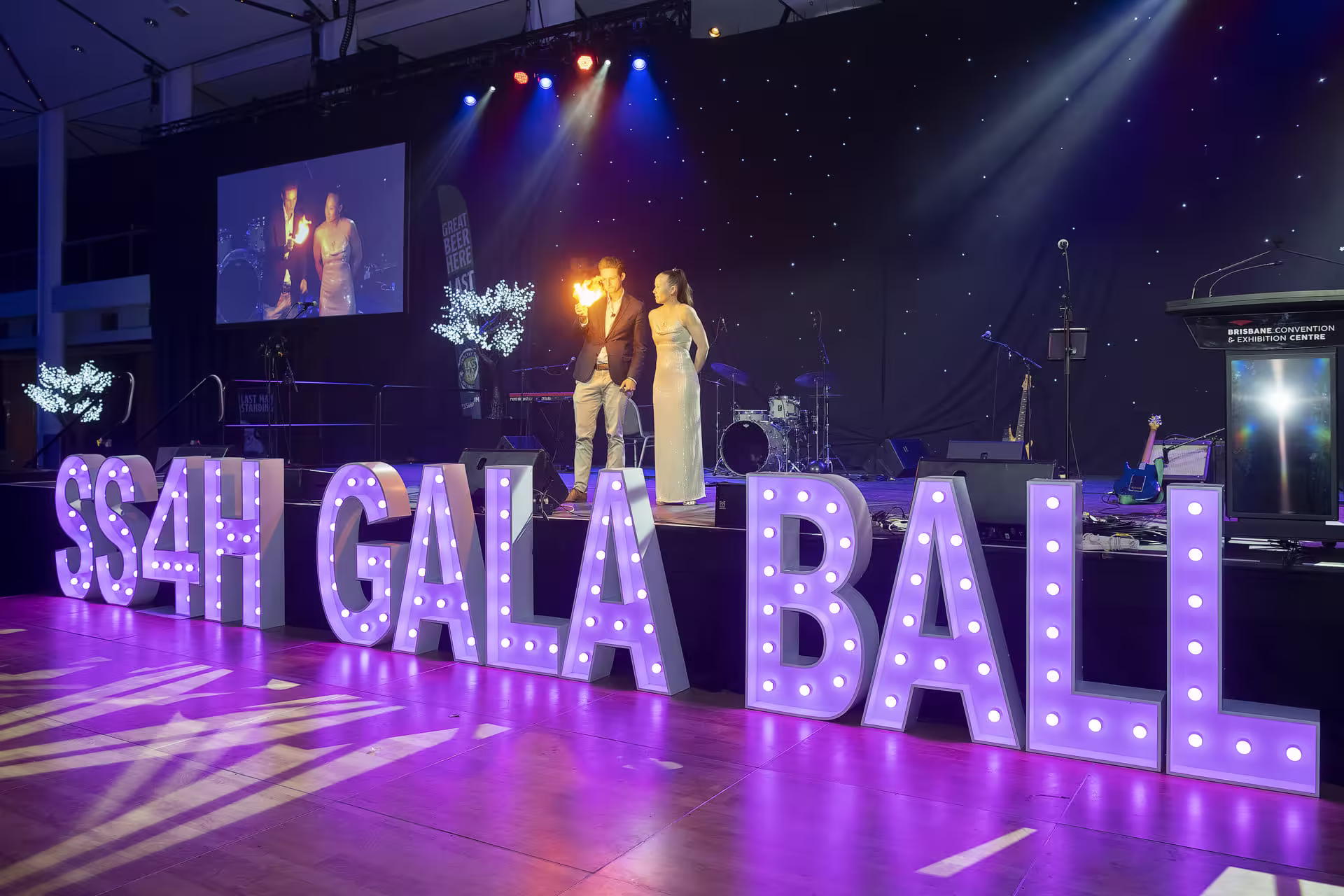 Corporate gala ball atmosphere with guests enjoying performance
