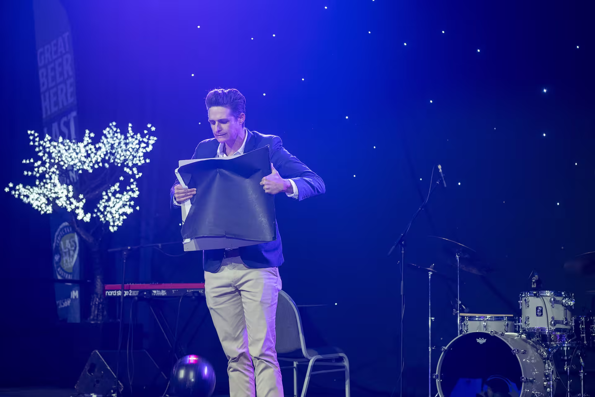 Jason Gray performing a stage magic show at a birthday party
