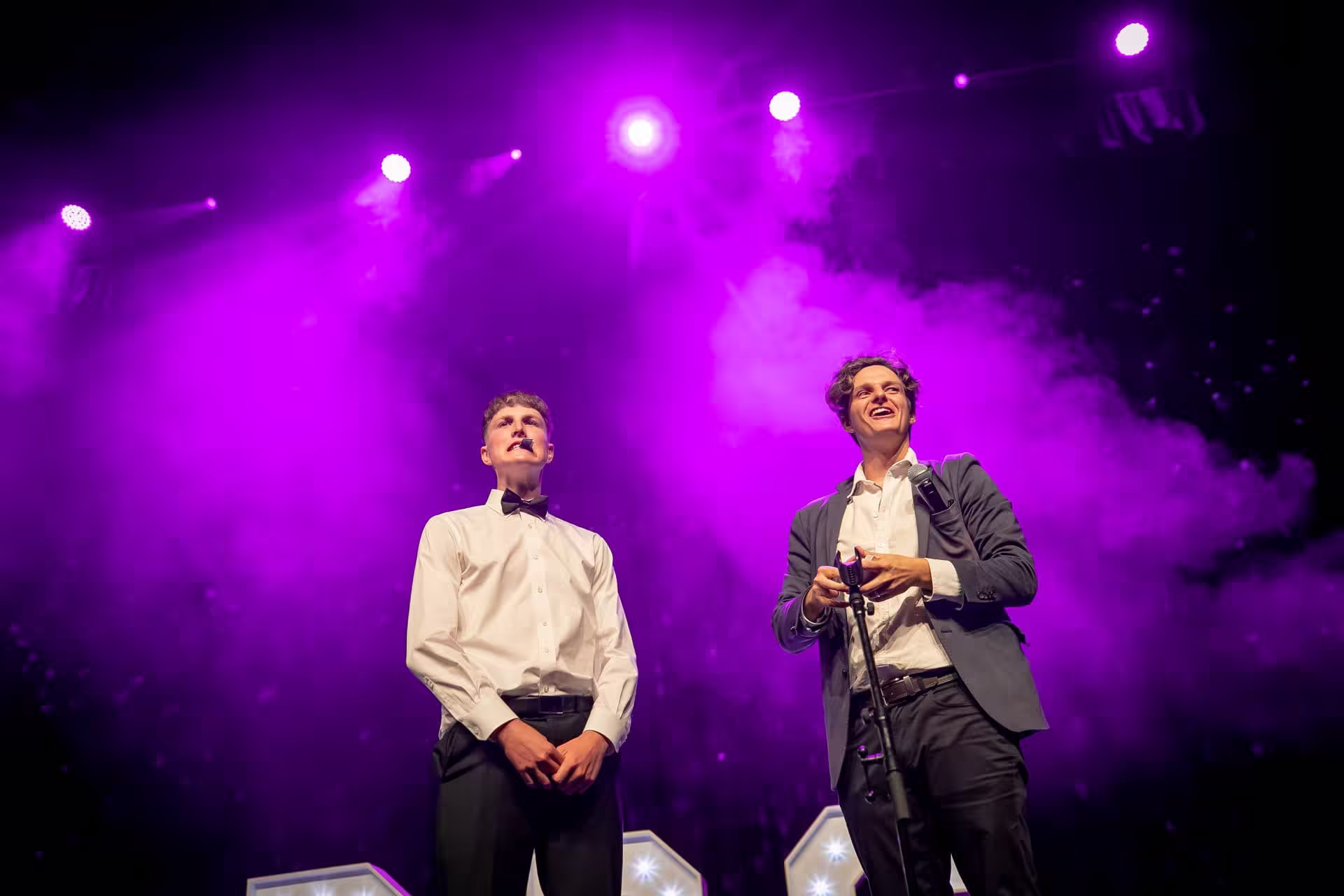 Jason Gray performing live stage magic with an assistant